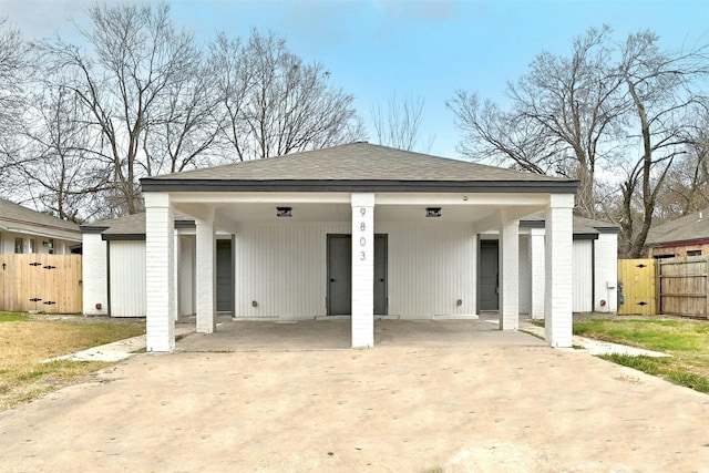 rear view of property with a carport