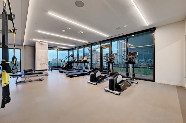 gym featuring floor to ceiling windows