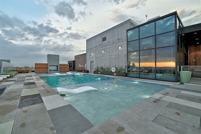 view of swimming pool with a patio