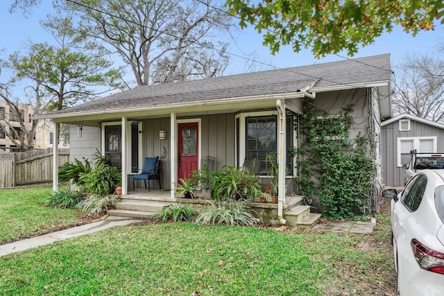 view of front of property with a porch and a front lawn