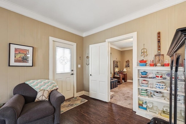 living area with crown molding and dark wood-type flooring