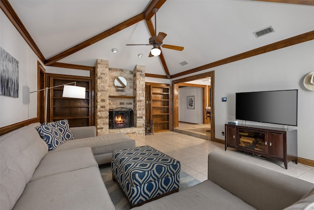 living room with built in shelves, a fireplace, vaulted ceiling with beams, ceiling fan, and light tile patterned floors