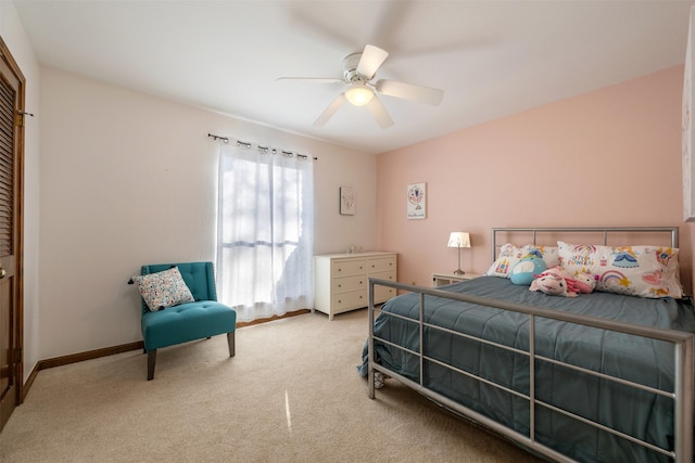 bedroom with ceiling fan and light carpet