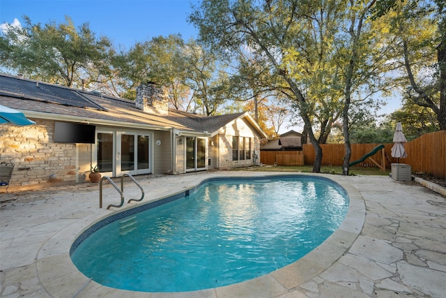 view of pool featuring a patio