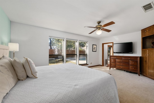 bedroom featuring ceiling fan, light colored carpet, and access to outside