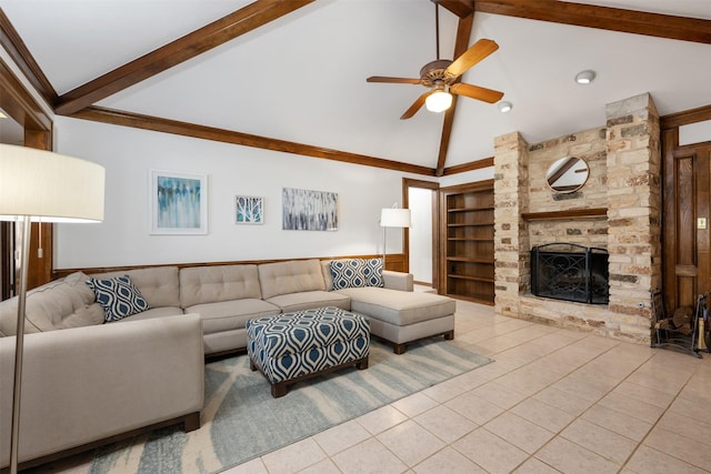 living room with ceiling fan, built in features, light tile patterned floors, a fireplace, and beamed ceiling