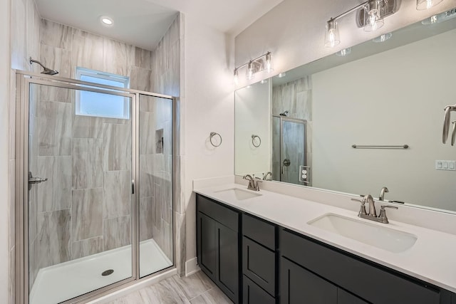 bathroom with an enclosed shower and vanity