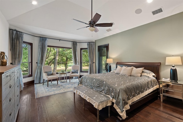 bedroom with ceiling fan, dark hardwood / wood-style floors, and lofted ceiling