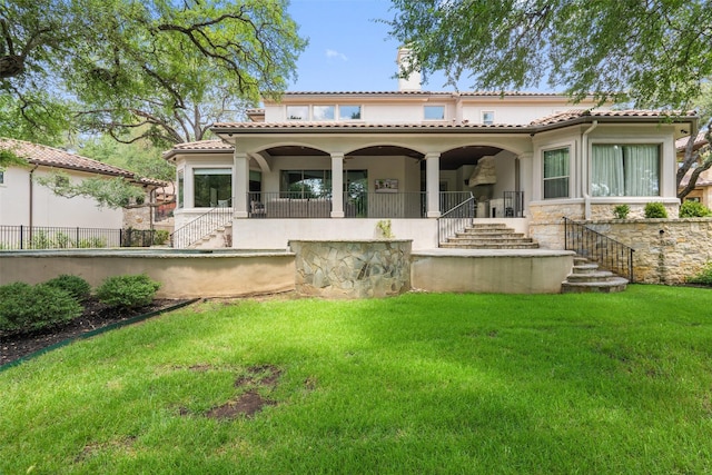 rear view of house with a lawn