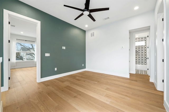 unfurnished bedroom with ceiling fan and light hardwood / wood-style floors