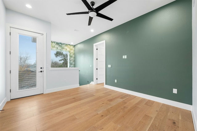 empty room with light wood-type flooring and ceiling fan