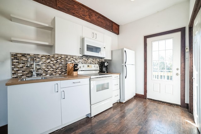 kitchen featuring white cabinetry, sink, white appliances, and backsplash