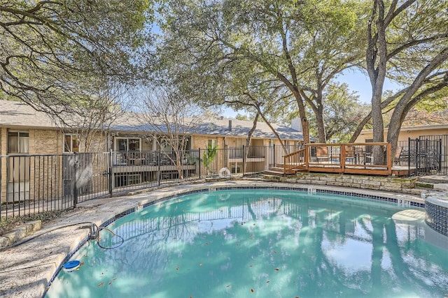 view of swimming pool featuring a wooden deck