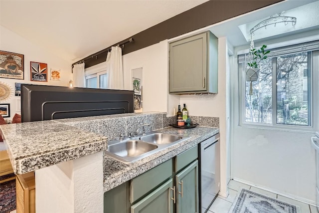 kitchen featuring sink, a kitchen breakfast bar, light tile patterned floors, stainless steel dishwasher, and kitchen peninsula