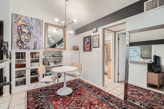 interior space with vaulted ceiling and a chandelier