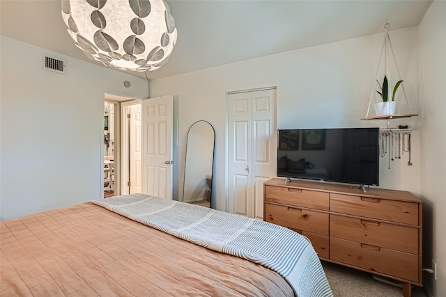 bedroom featuring carpet and a closet