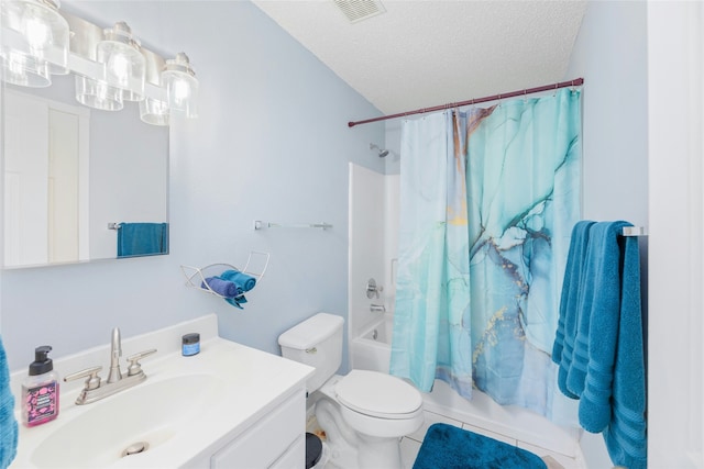 full bathroom featuring toilet, a textured ceiling, shower / bath combination with curtain, tile patterned floors, and vanity