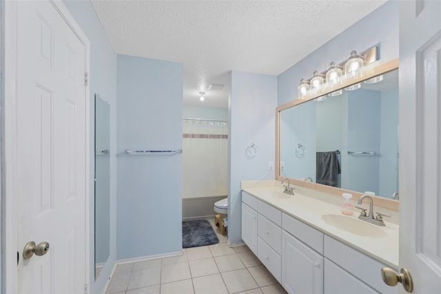 full bathroom with toilet, shower / tub combo, a textured ceiling, tile patterned floors, and vanity