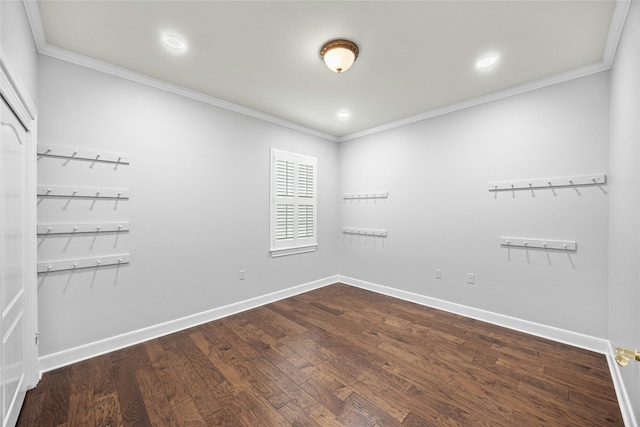 empty room featuring wood-type flooring and ornamental molding