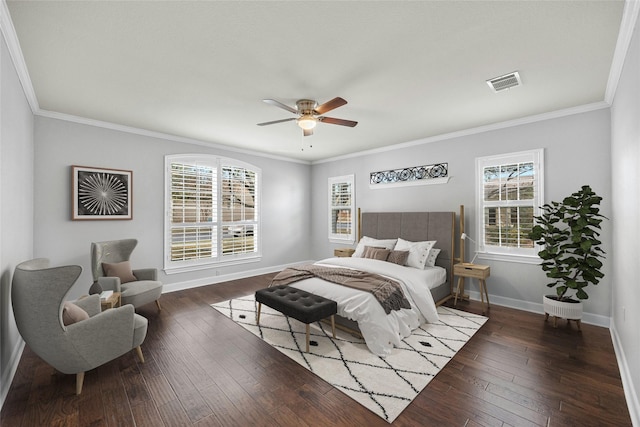 bedroom with ceiling fan, ornamental molding, and dark hardwood / wood-style flooring