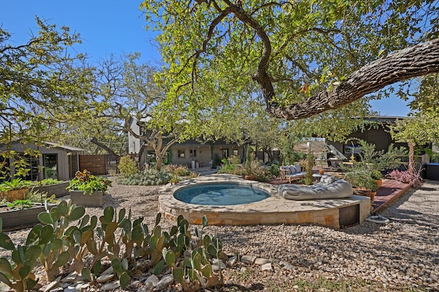 view of pool with an in ground hot tub