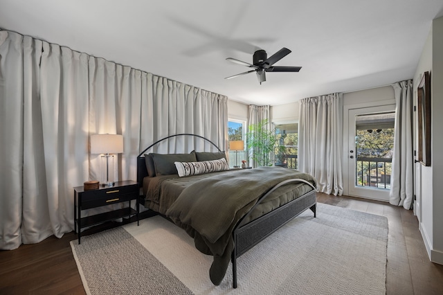 bedroom with hardwood / wood-style floors, multiple windows, access to exterior, and ceiling fan