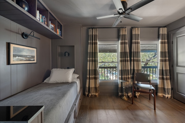 bedroom with ceiling fan and wood-type flooring