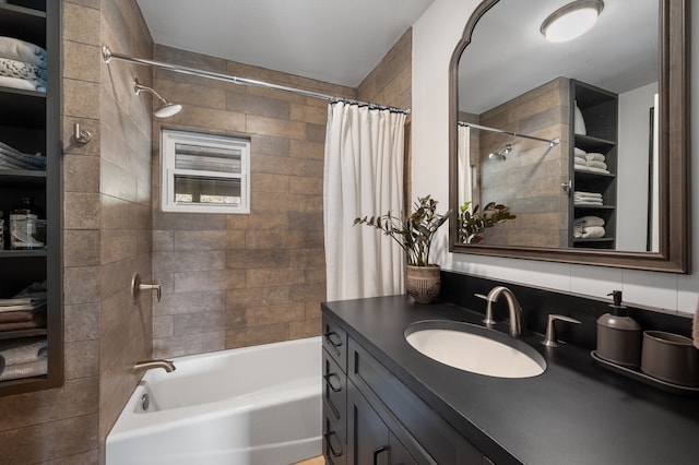 bathroom with vanity, shower / bath combo with shower curtain, and decorative backsplash