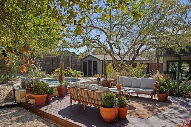 wooden terrace with a fenced in pool and an outdoor living space