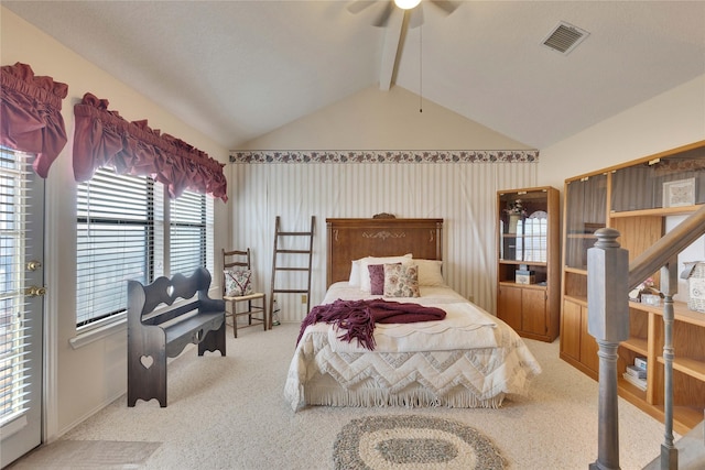 carpeted bedroom featuring vaulted ceiling with beams and ceiling fan