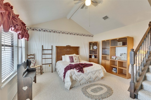 carpeted bedroom with vaulted ceiling with beams and ceiling fan