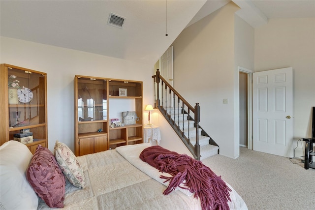 bedroom with vaulted ceiling and carpet