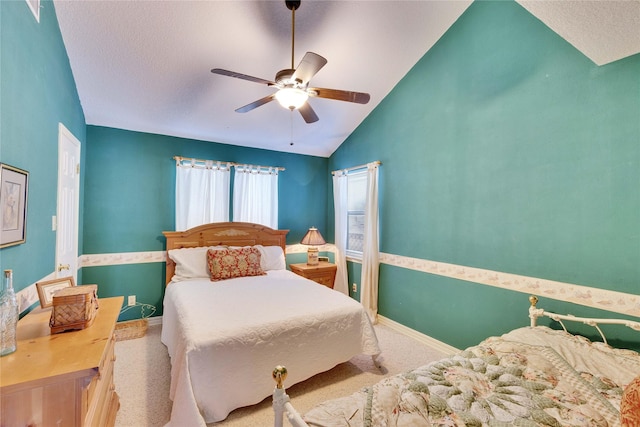 bedroom with ceiling fan, light carpet, and lofted ceiling