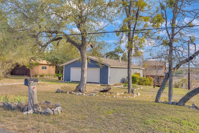 view of front facade featuring a garage and a front lawn