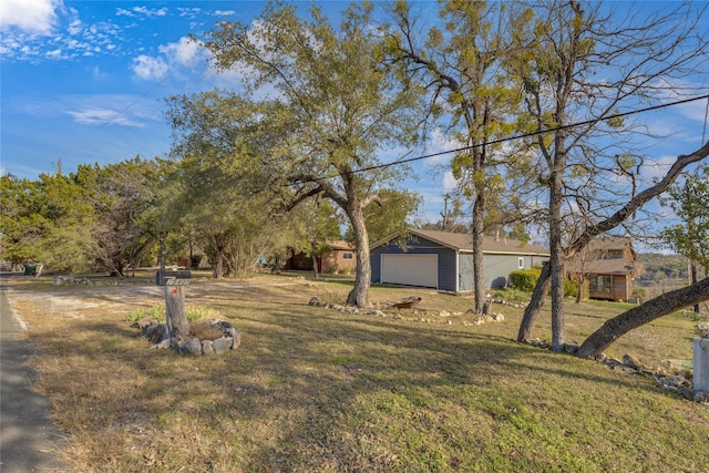 view of yard with a garage