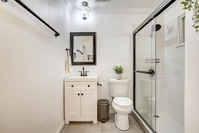 bathroom featuring tile patterned floors, a shower with door, crown molding, and toilet