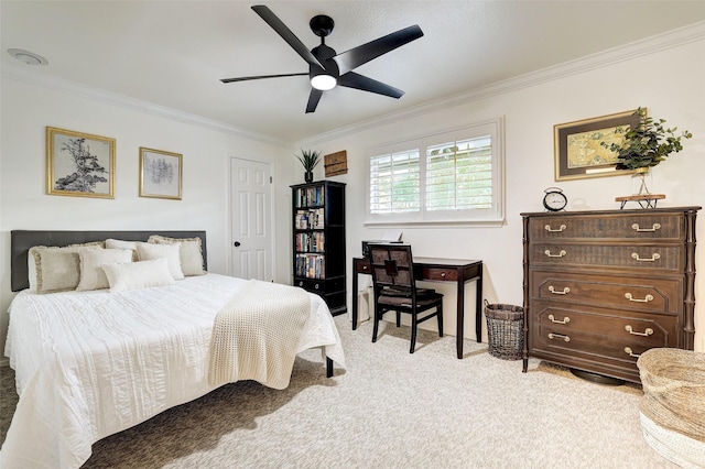 carpeted bedroom with ceiling fan and ornamental molding