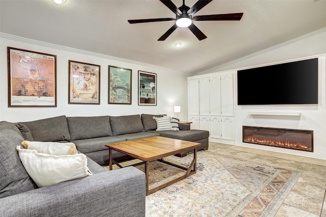 living room with a textured ceiling, vaulted ceiling, ceiling fan, and ornamental molding