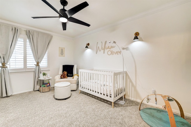 bedroom featuring crown molding, carpet, ceiling fan, and a nursery area