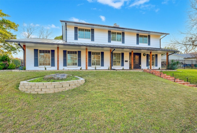 view of front of property featuring a front yard and a porch