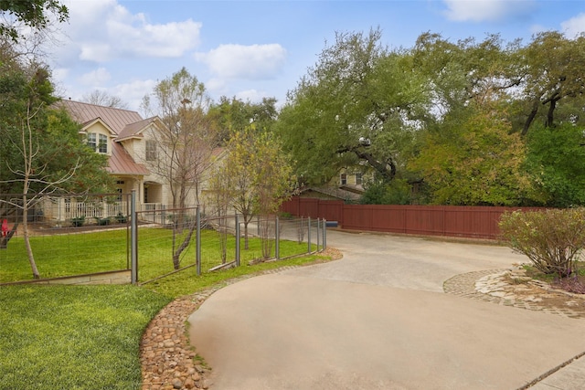 view of property's community with a lawn