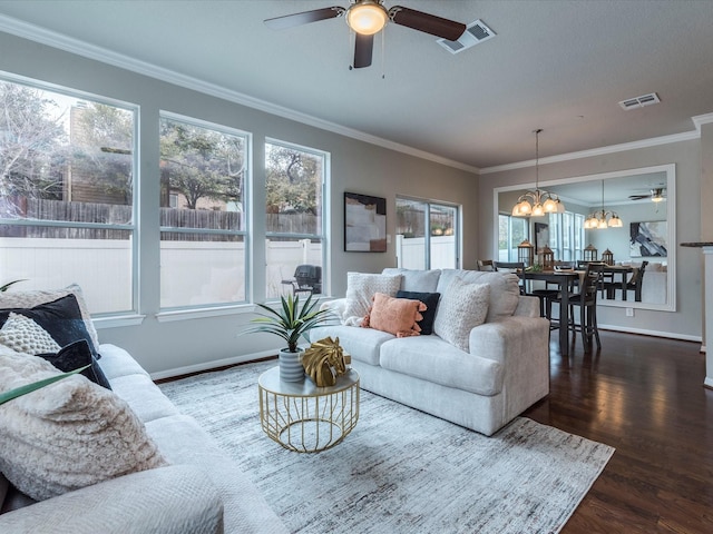 living room featuring a wealth of natural light, ornamental molding, and wood-type flooring