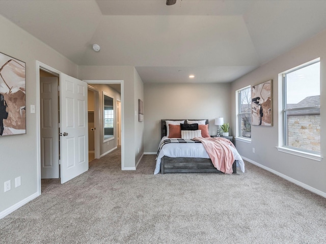 carpeted bedroom featuring vaulted ceiling