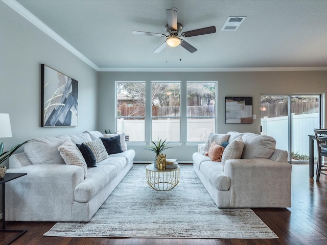 living room featuring ceiling fan, dark hardwood / wood-style floors, and crown molding