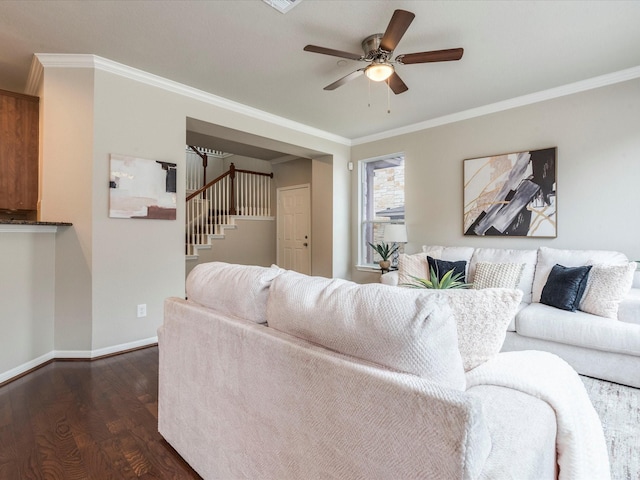 living room with dark wood-type flooring, ceiling fan, and ornamental molding