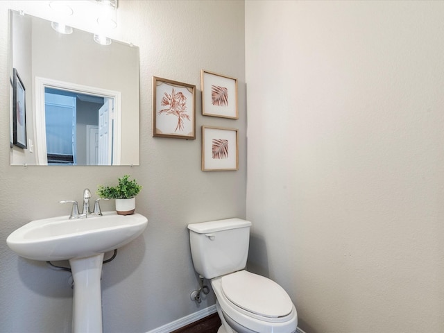 bathroom featuring sink and toilet