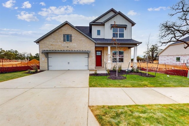 craftsman-style home with a garage and a front yard