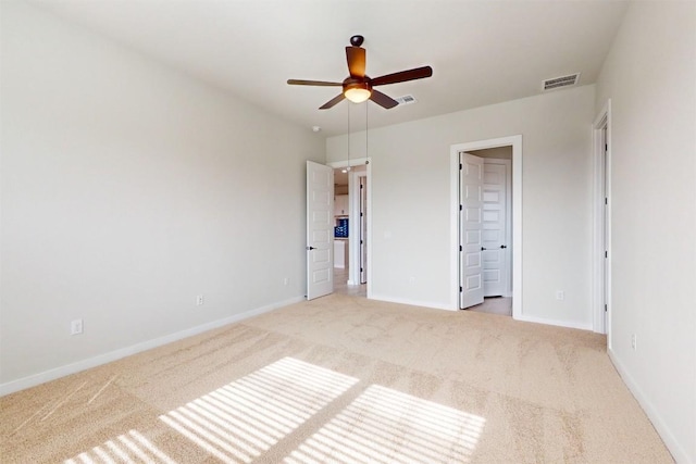 unfurnished bedroom with carpet flooring and ensuite bath