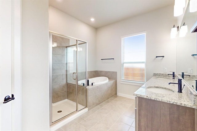 bathroom featuring vanity, tile patterned flooring, and shower with separate bathtub