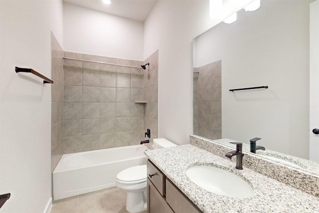 full bathroom featuring vanity, tile patterned floors, toilet, and tiled shower / bath